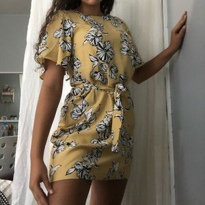 Super cute yellow mini dress with flower designs